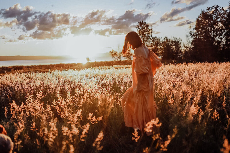 lady walking in long grass