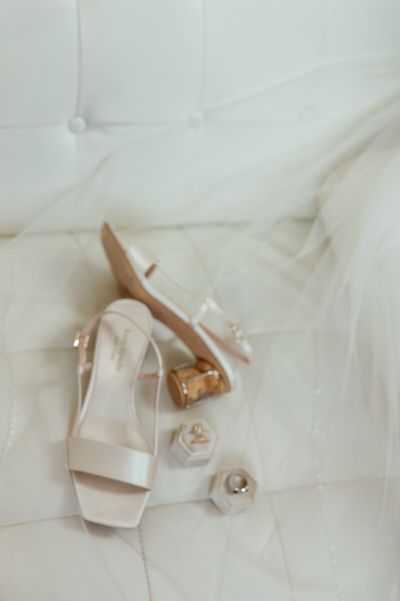 Lace-edged cathedral veil and ivory heels – Beaufort, NC bridal details.