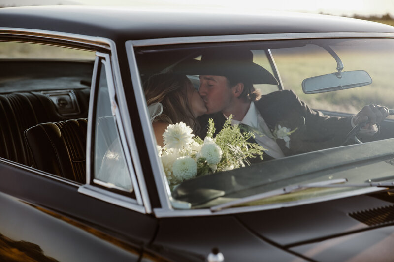 Couple kissing in car