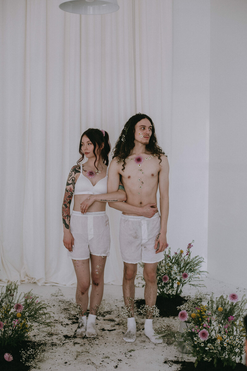 Couple locking arms in a studio photoshoot in albuquerque.