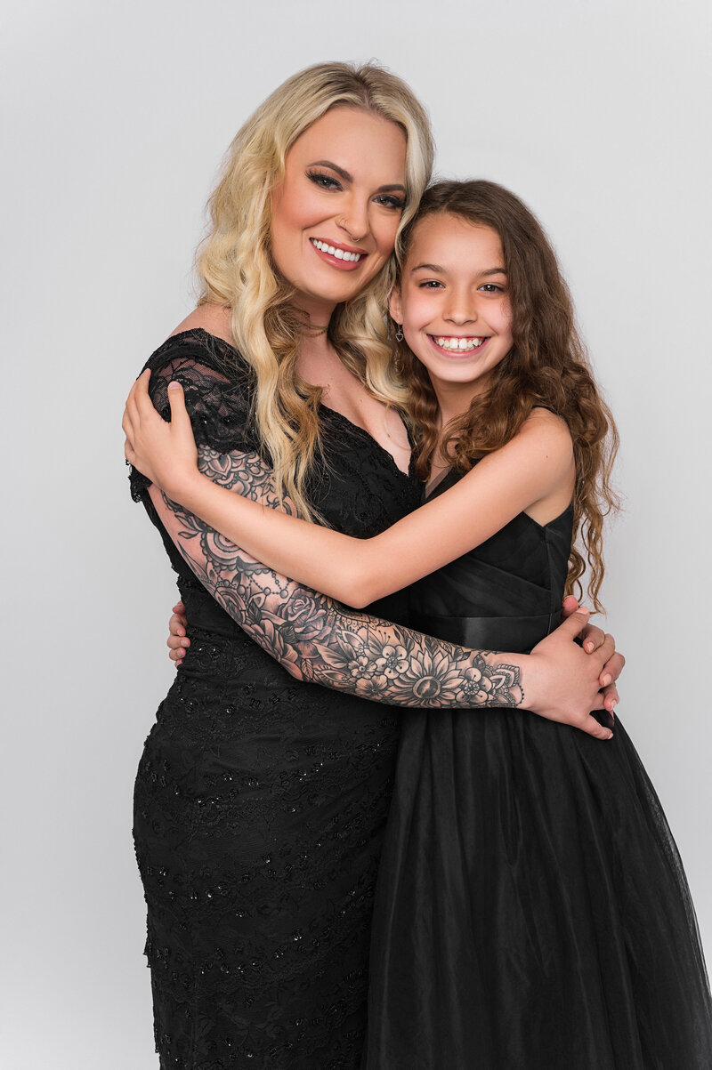 Luxury mother daughter hugging happy portrait.
