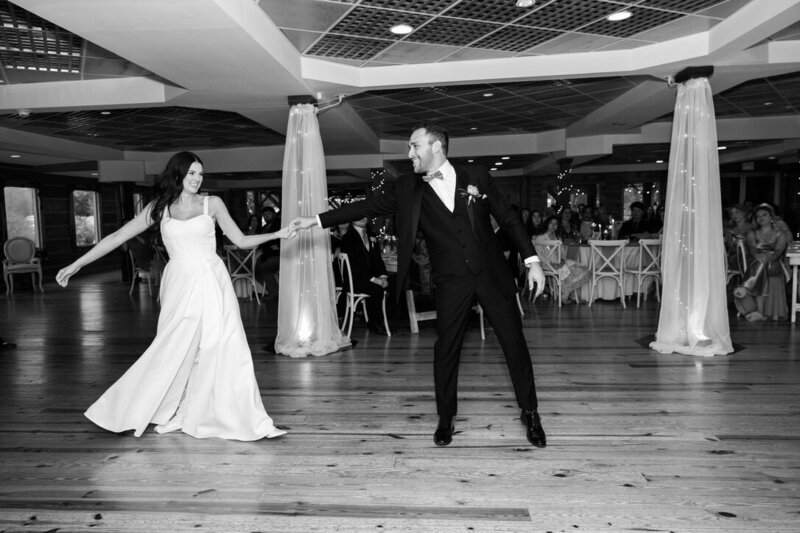 Bride and groom happily dancing in their wedding