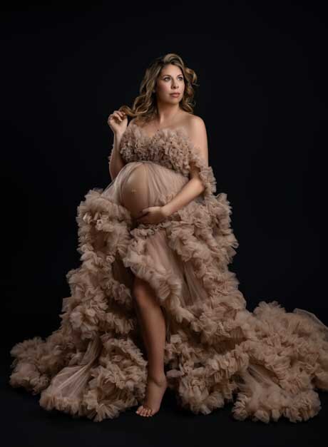 Fine art portrait of pregnant mom in couture maternity dress. Photo taken at Atlanta Photo studio.