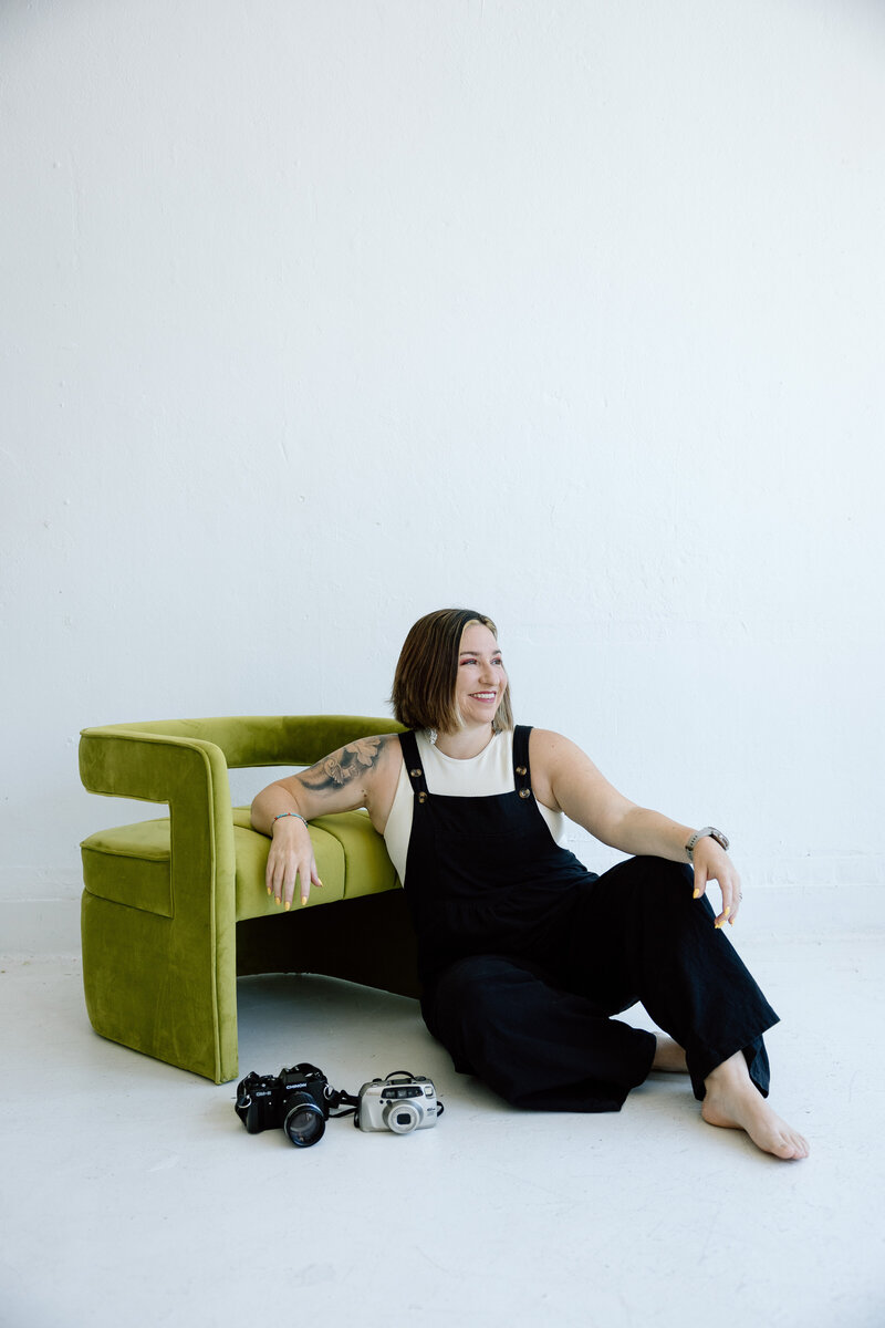 Mariah sitting on a bench smiling