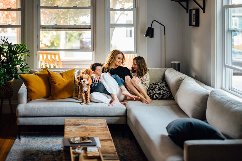 mom with kids and dog on couch