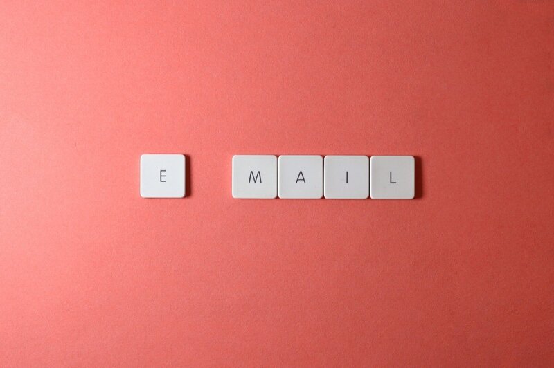 Jenny Laine Designs letter tiles that spell out Email on a red background.