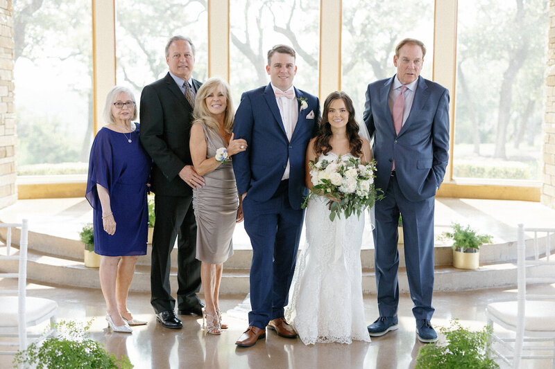 Family portraits at Canyonwood Ridge with Hill Country backdrop