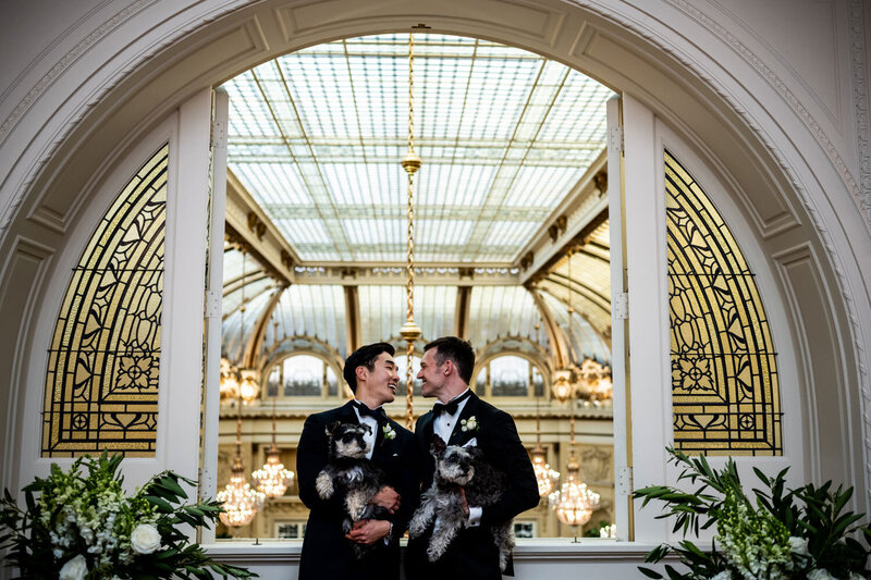 San Francisco wedding photographer documents same-sex couple in Palace Hotel Garden Court with stunning architectural backdrop