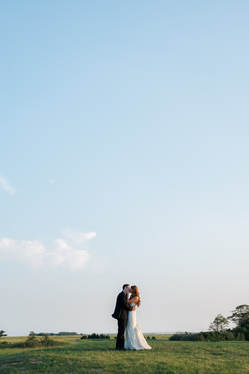 A bride and groom in the distance at their Atlantic City Country Club wedding in New Jersey.