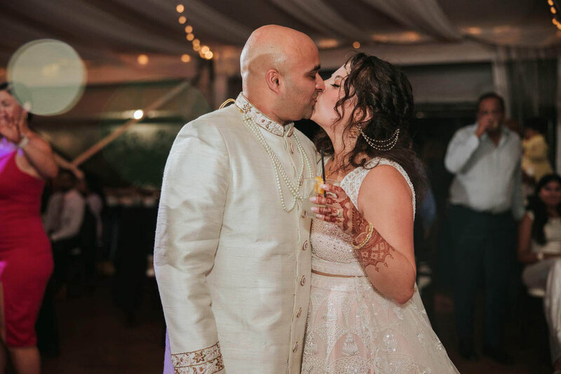 Bride and groom celebrating the next chapter of their life together at  Bartram's Garden in Philadelphia