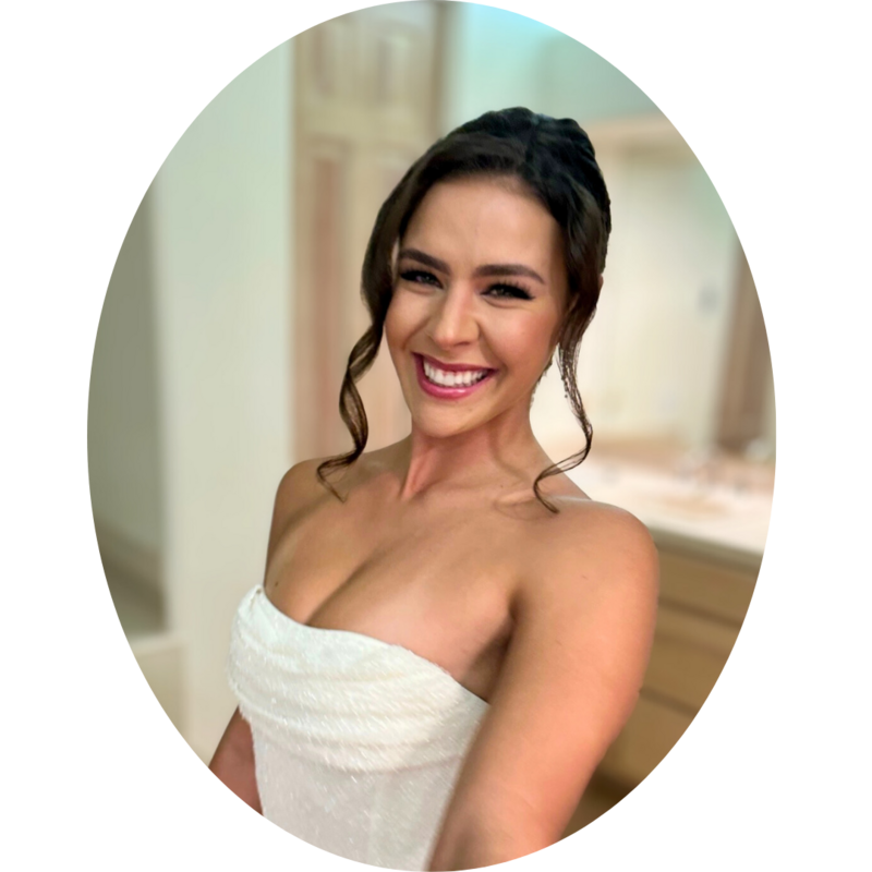 Smiling brunette woman in a strapless white dress with vintage-inspired curled tendrils, styled by Your Girl Friday LV for a soft romantic bridal look.