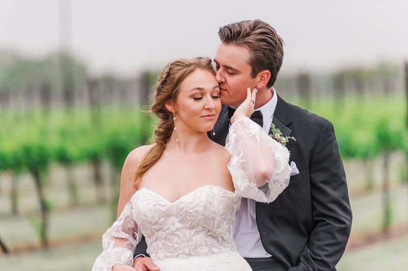 Bride and Groom  embracing in a black and white photo. - shot by Austin TX based Wedding Photographer Lydia Teague