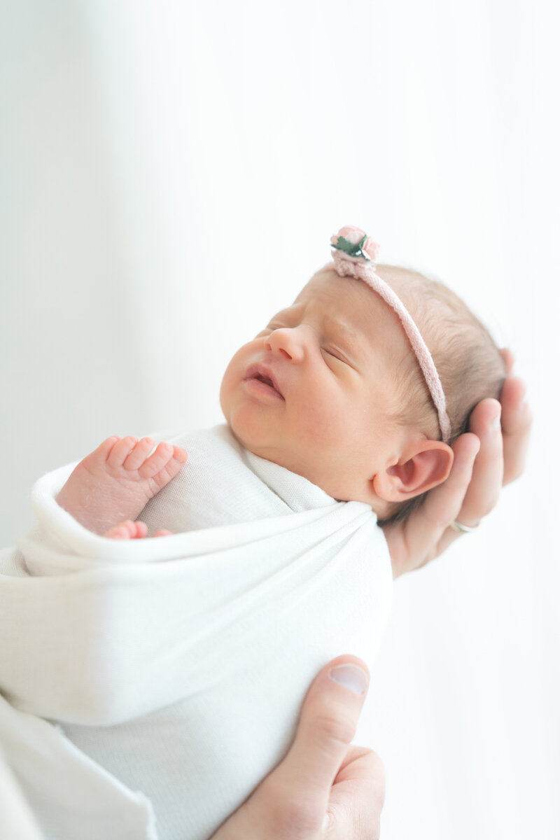 In-studio Maternity Session with floor floral arrangments for mother's day minis photoshoot