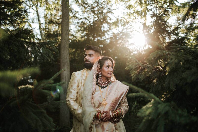 South Asian couple hug and enjoy solitude after ceremony in the canopy of the trees at Royal Alberts Palace