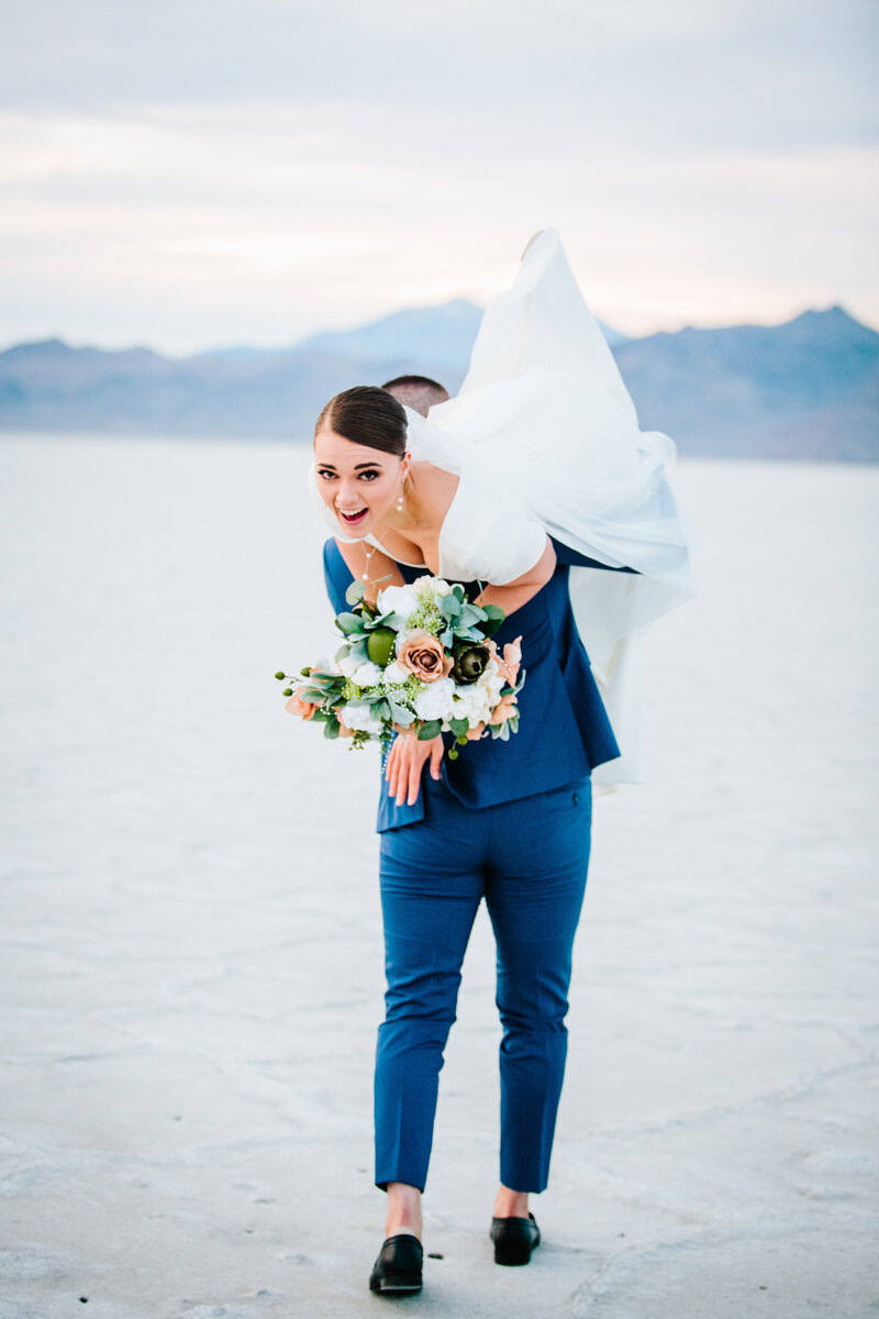 Jackson Hole photographers capture bride on grooms back