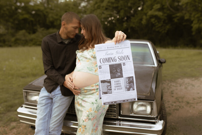 outdoor family photography session located in columbia, maternity session with homemade newspaper announcement of twin girls coming soon in front of vintage car el camino