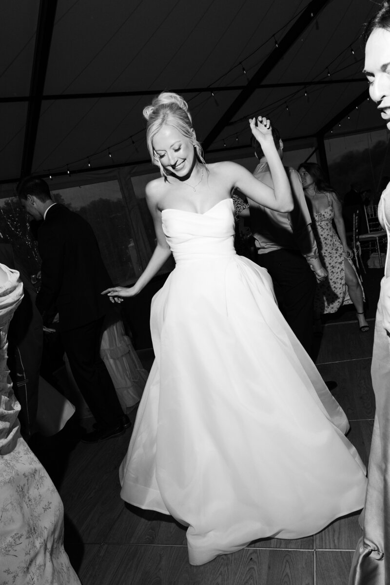 Flash photo of the bride dancing at her reception at French Park Wedding Venue in Cincinnati OH