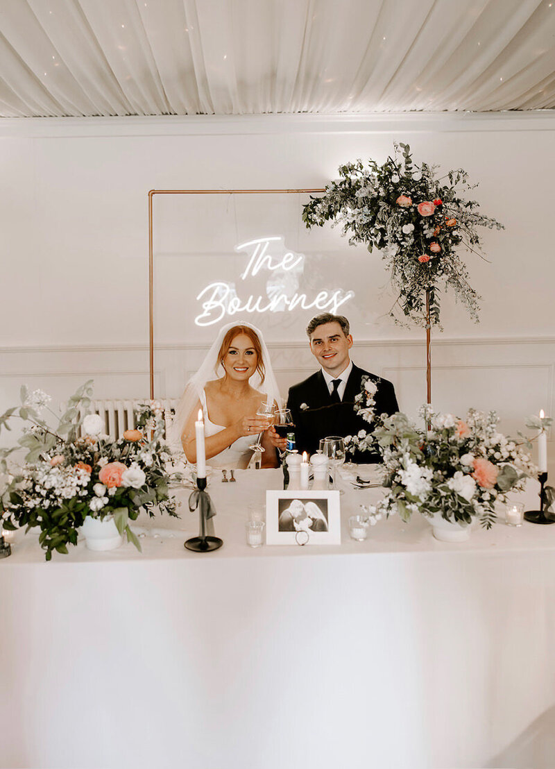 bride and groom sitting at table