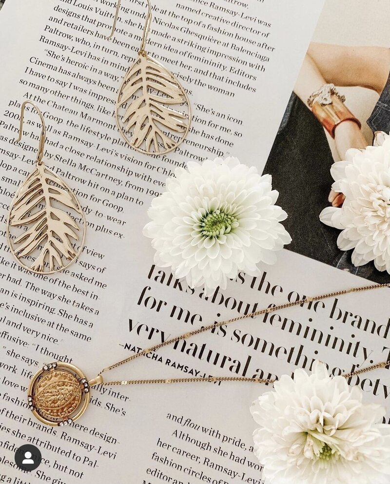 Magazine with earrings, flower and necklace. 