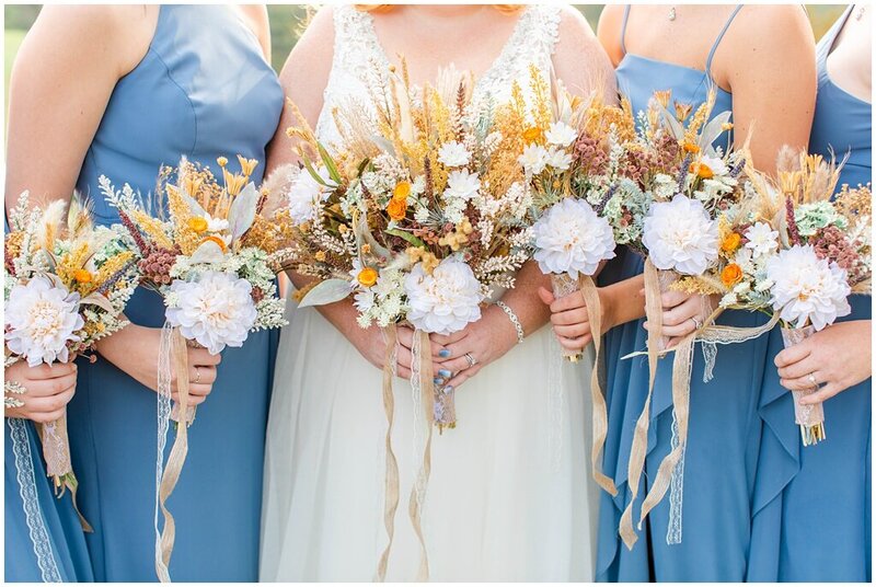 bridesmaids holding creamy boho florals