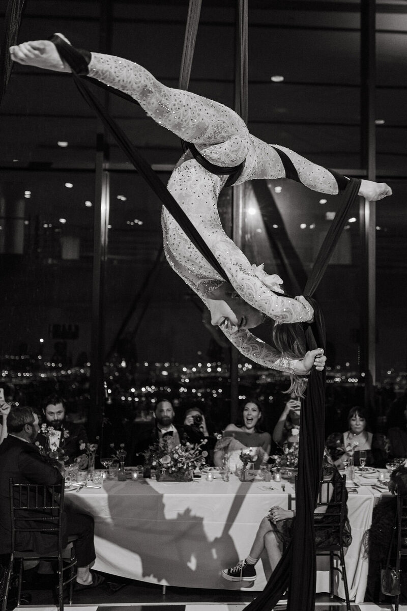Aerialist performing act on silks