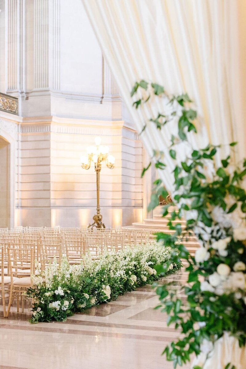 Bride sitting at a chair.