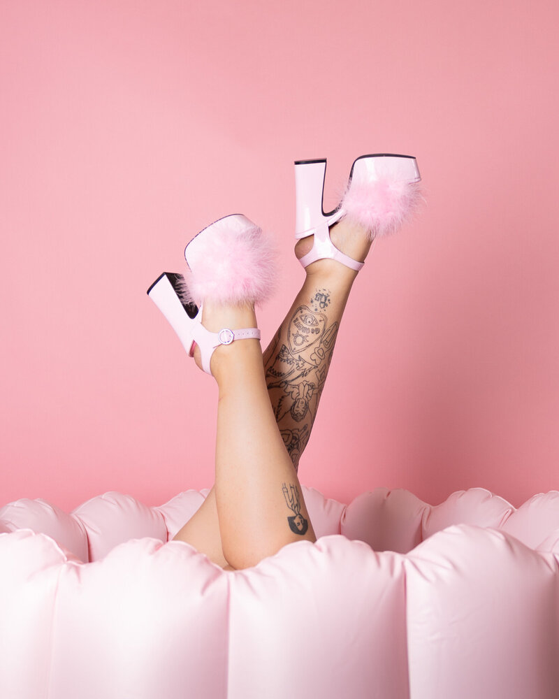 lexi pink shoes laying in pink chair