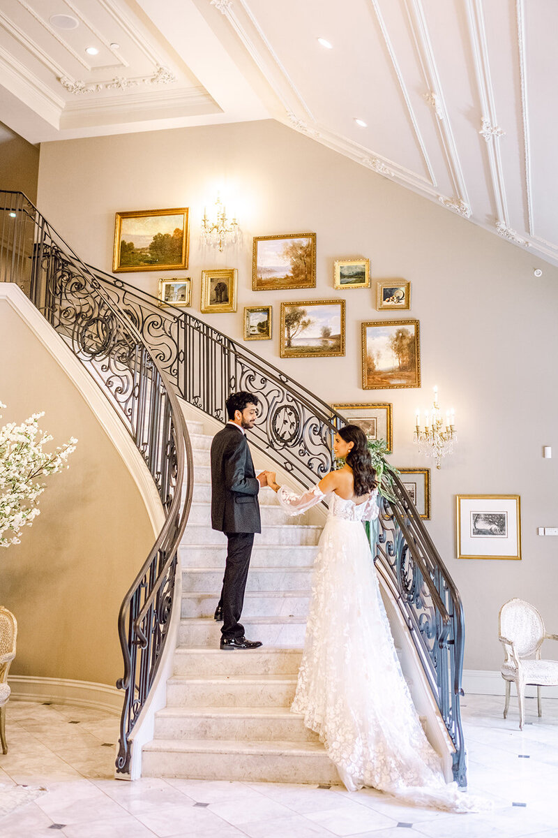 bride and groom on staircase