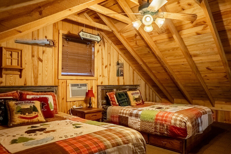 Loft bedroom inside mountain cabin near Mena, AR
