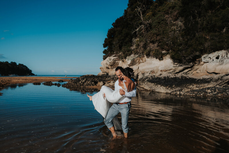 Bride & Groom photos in the water at the beach