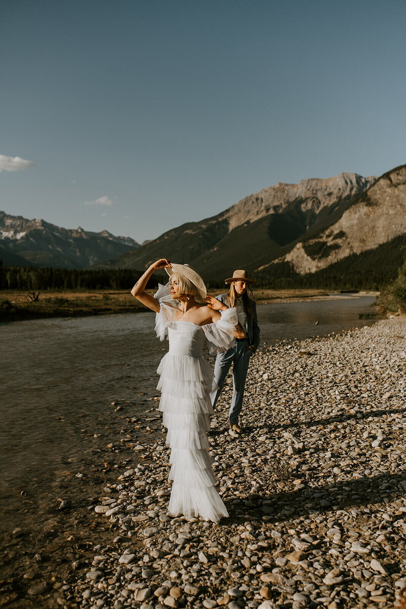 Bride-in-front-groom-behind-Canmore-Alberta-Canada-Elopement