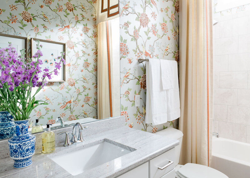 Classic bathroom interior with wallpaper and white sink