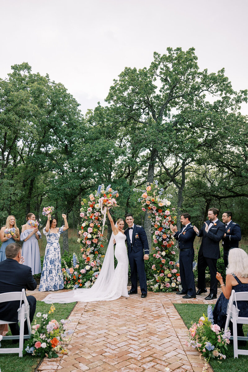 Couple celebrating at wedding ceremony planned by Bianca Nichole and Co