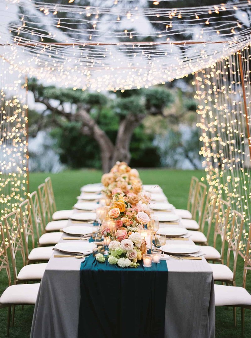 modern teal gold and blush table wedding styling with canopy of lights