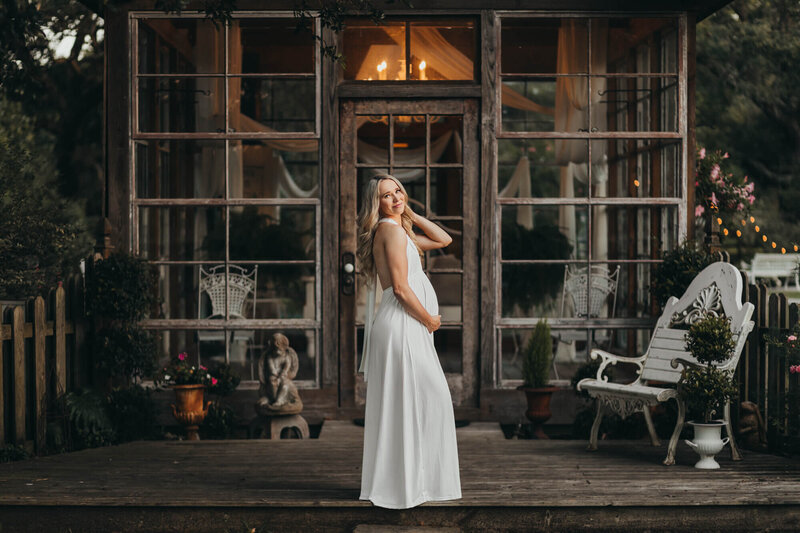maternity session in Teton Village, Wyoming with mom in dark green gown.