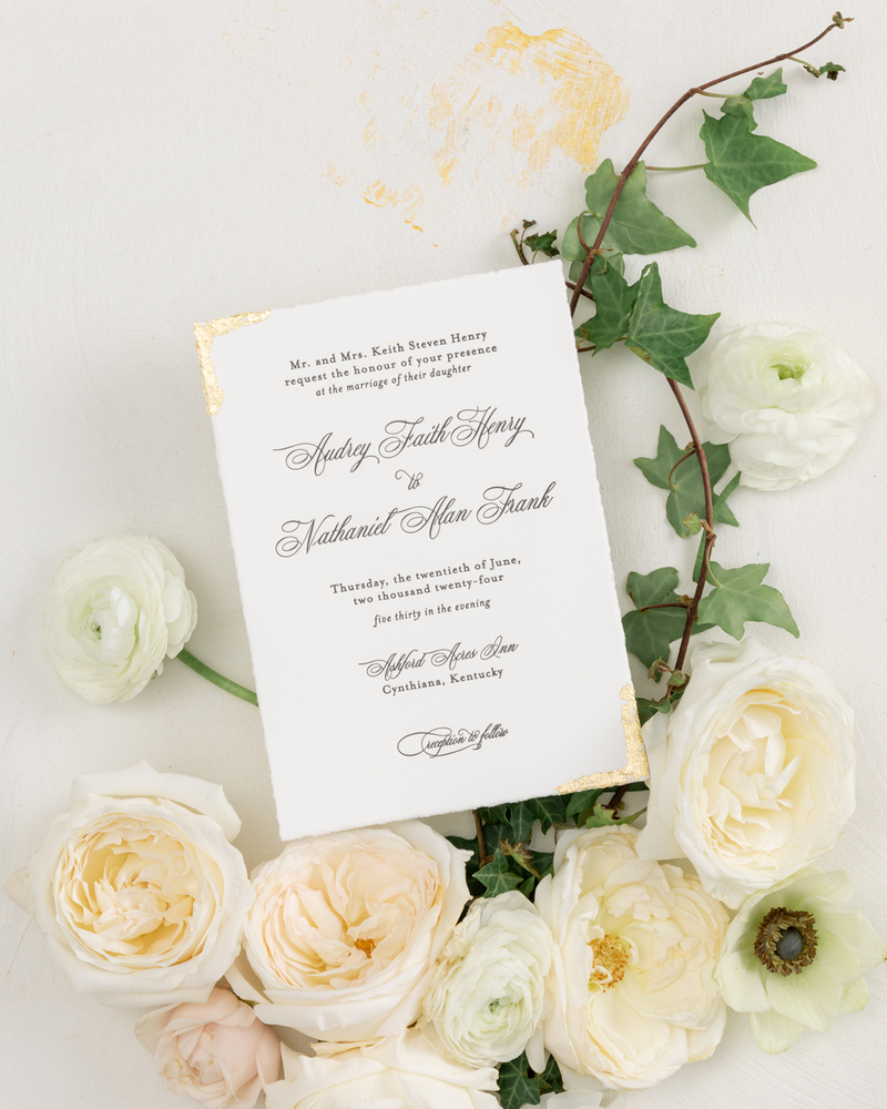 Classic wedding invitation with gold leaf edges and script typography by Seventh and Anderson, Montana wedding invitation and stationery designer.
