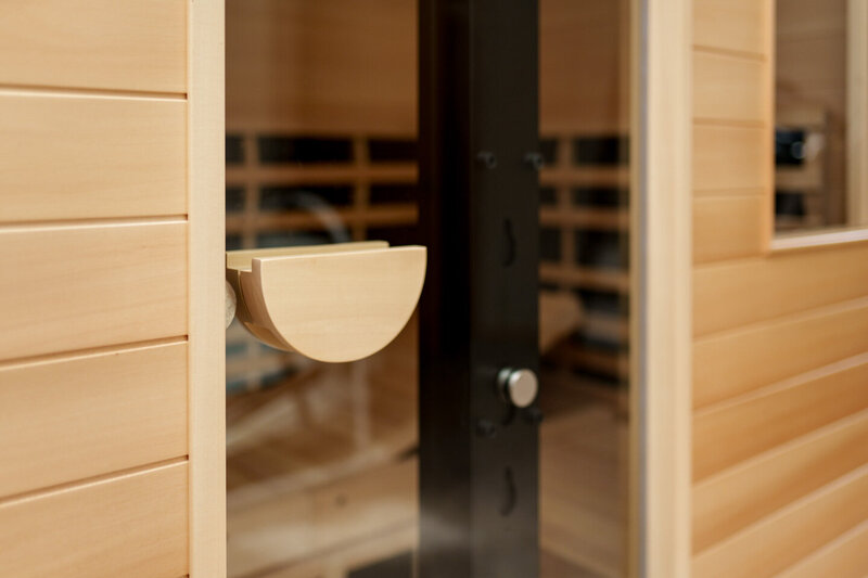 Looking through the glass door of an infared sauna