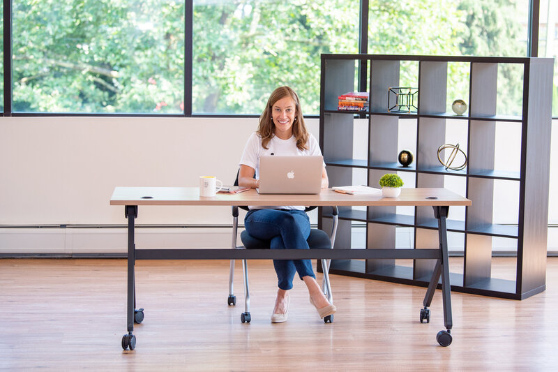 A female career coach is sitting and working in her office in Fairfield, New Jersey.