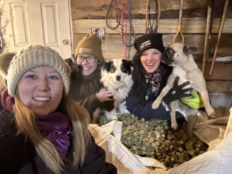 Three Spirit Respite Ranch staff members with their pet dogs.