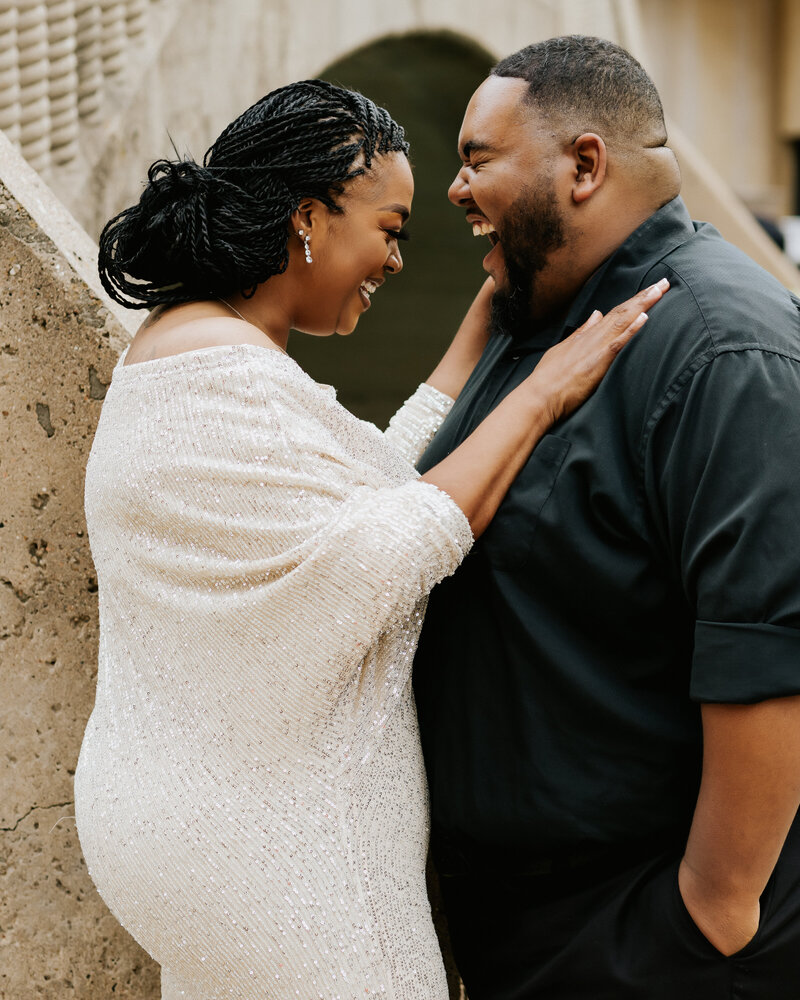 Experience the pure joy and deep connection radiating from this heartfelt portrait capturing the love and togetherness of a beautiful black couple, expertly captured by L. Marie Experience