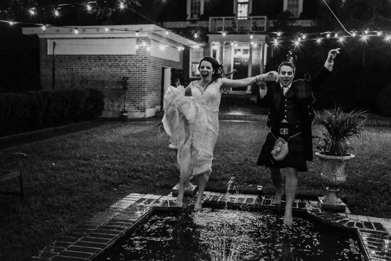 Daniel and Alexandria jumping into a fountain at their wedding