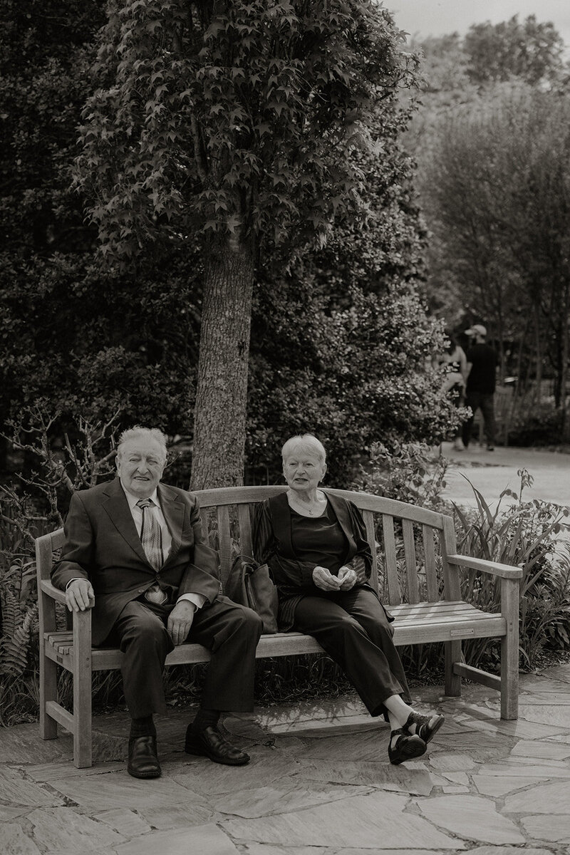 Grandparents sitting together on a bench in black and white, Intimate Wedding, Elopement, and Family Photography NYC and Western North Carolina Area