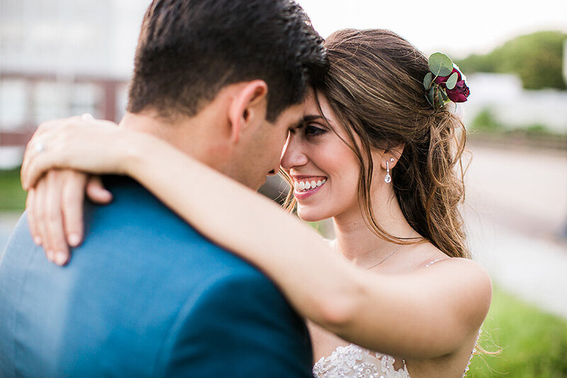 Bride and groom under Bald Head Island Lighthouse