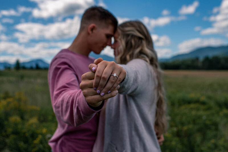 couple shows off engagement ring