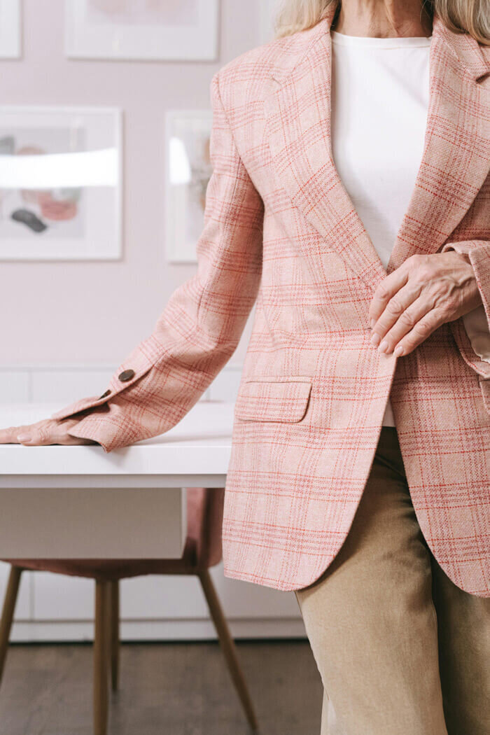 Real estate agent in a pink blazer