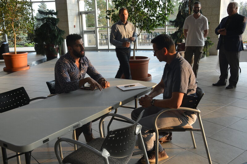 Team members engaged in a leadership discussion, emphasizing accountability and mindset in a performance-driven culture