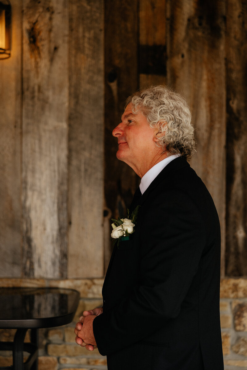 The father of the bride waiting for the first look.