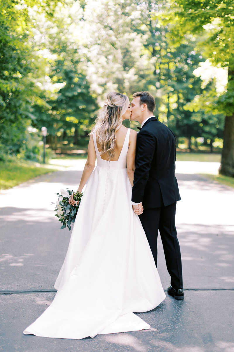 Samantha and Jacob share a kiss at their Morris Estate wedding in NIles, MI, photo by Cynthia Mae Photography Grand Rapids Wedding Photographer