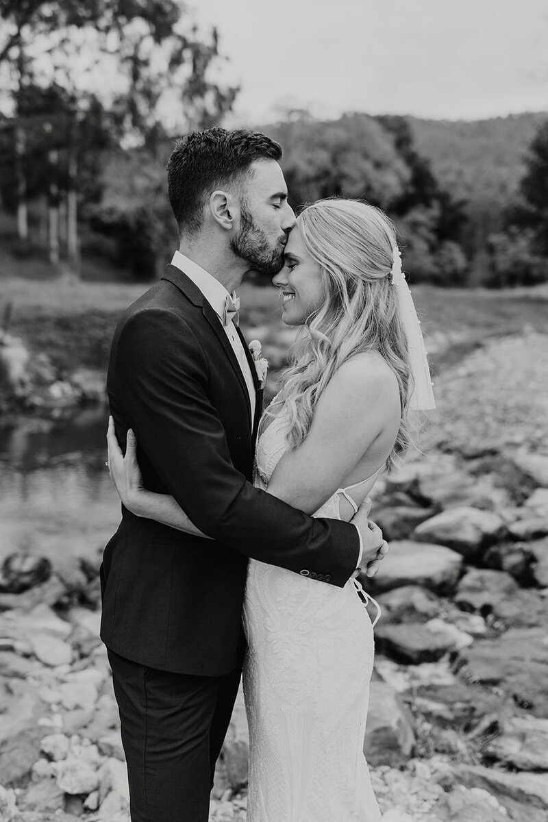 B&J-Groom kissing bride on forehead