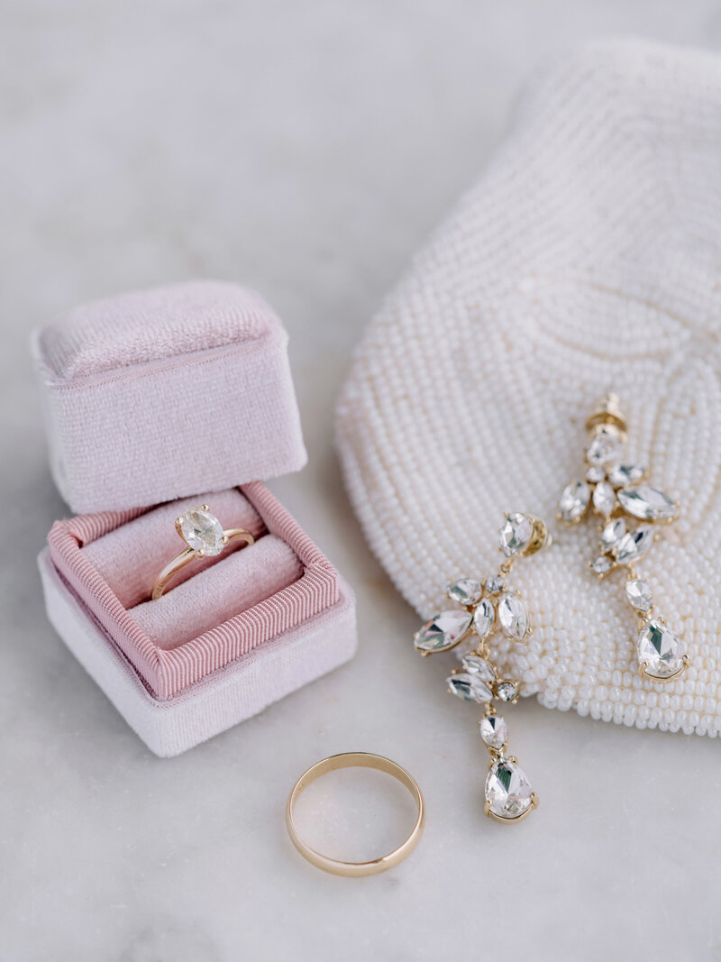 blush pink ring box with wedding details